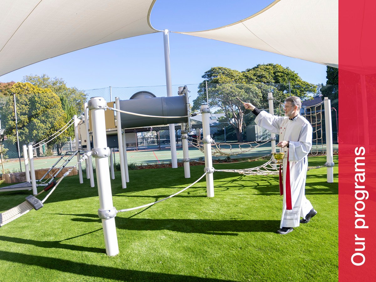 Celebrating the opening and blessing of new primary rotunda, playground and Rosary Garden