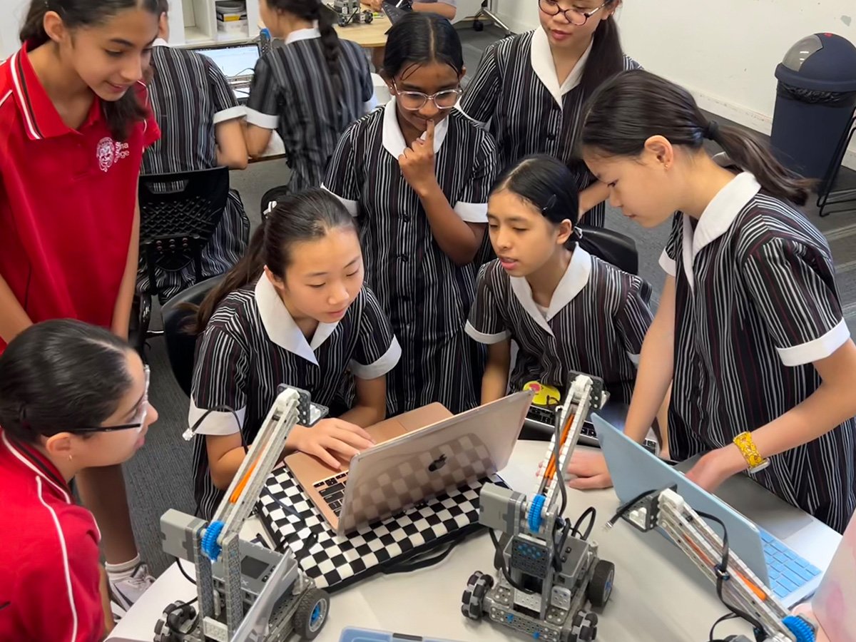 Group of students working on robotics.