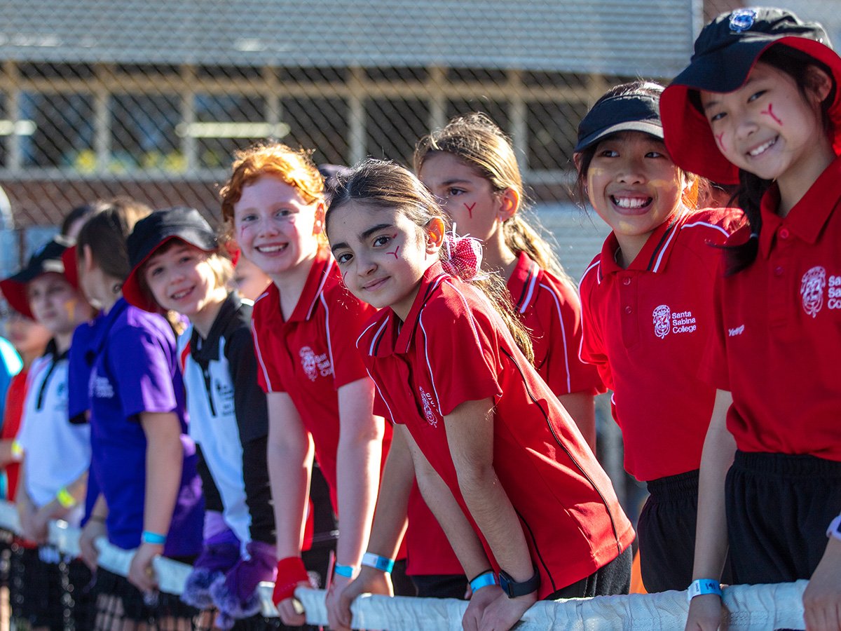 House system students supporting tennis