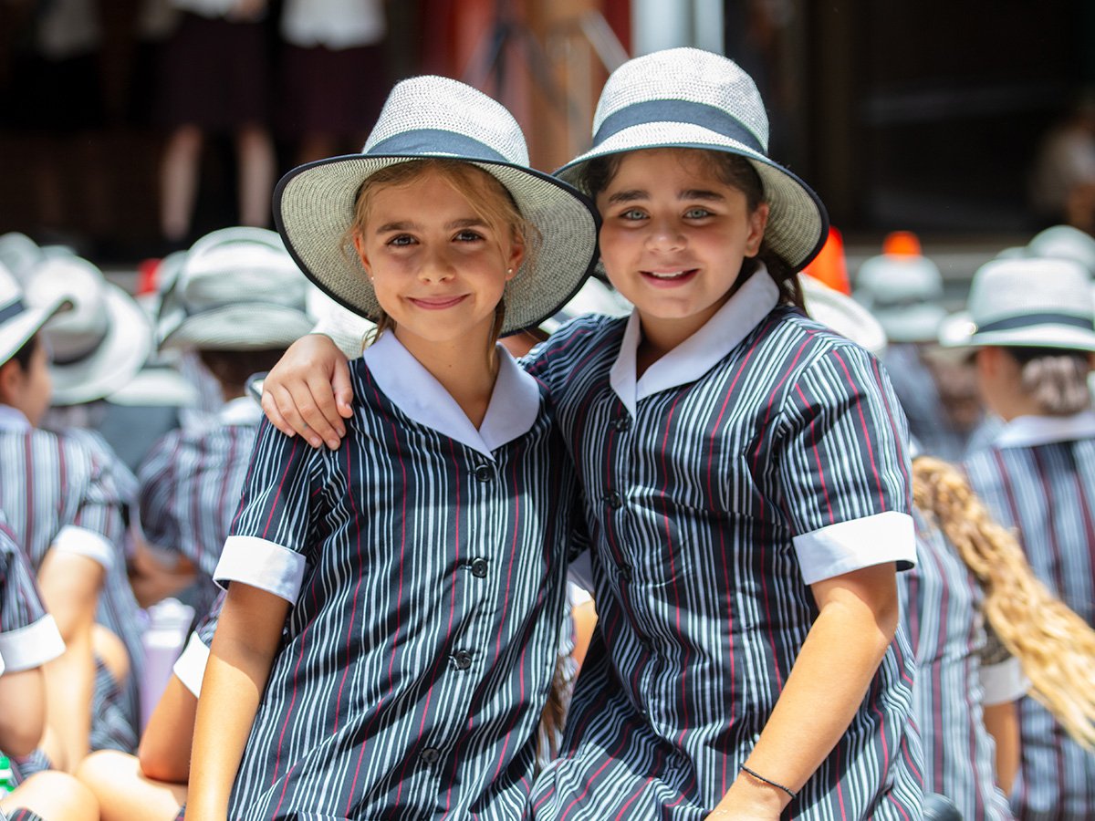 Two students smiling.